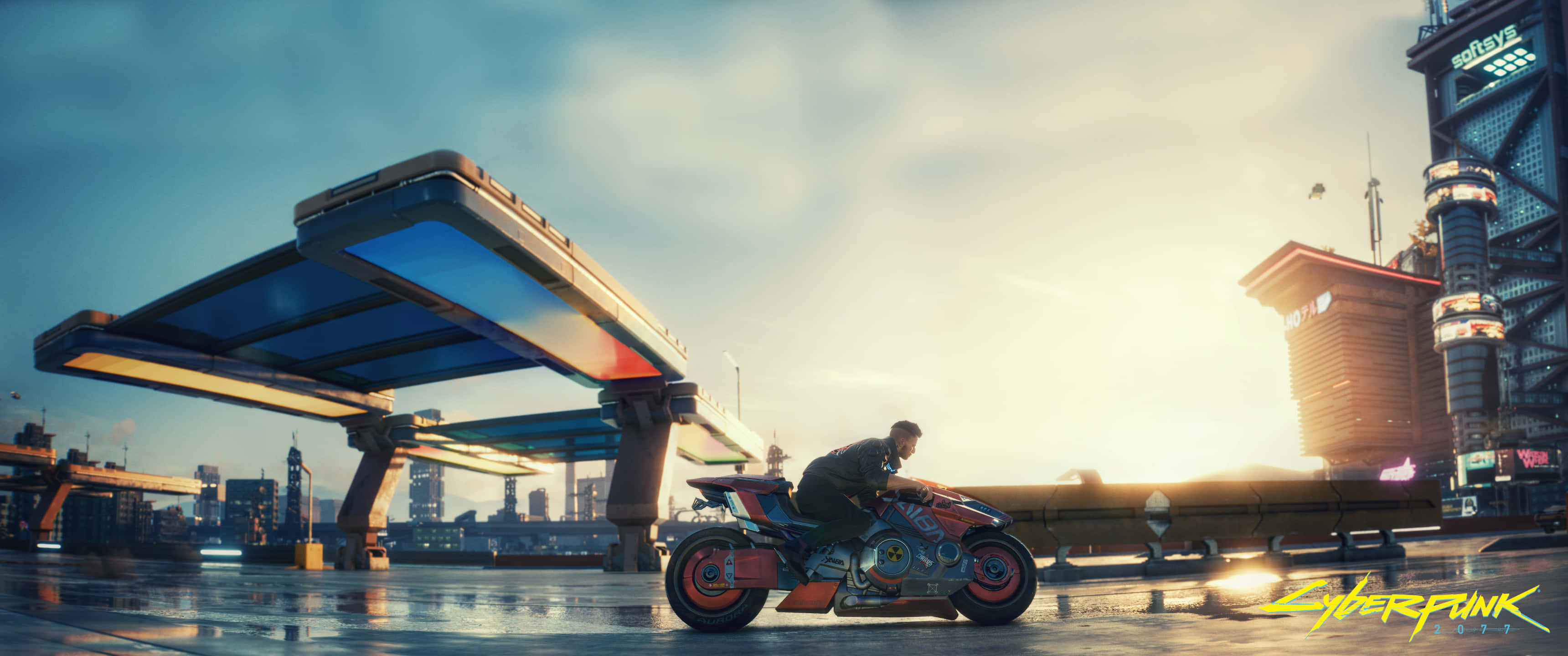 A Man Riding A Motorcycle In Front Of A City Wallpaper
