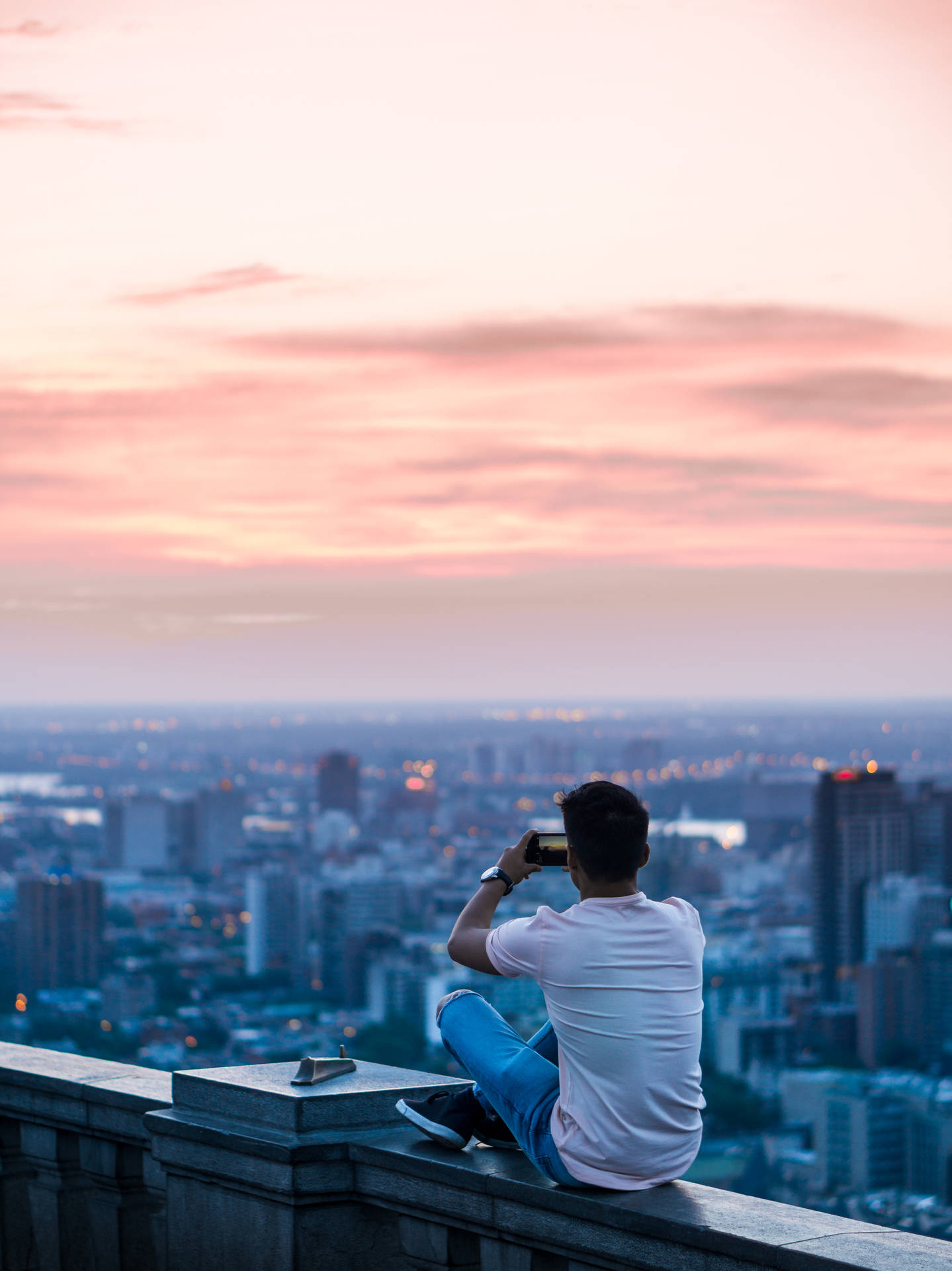 "A boy enjoying the view from the rooftop" Wallpaper