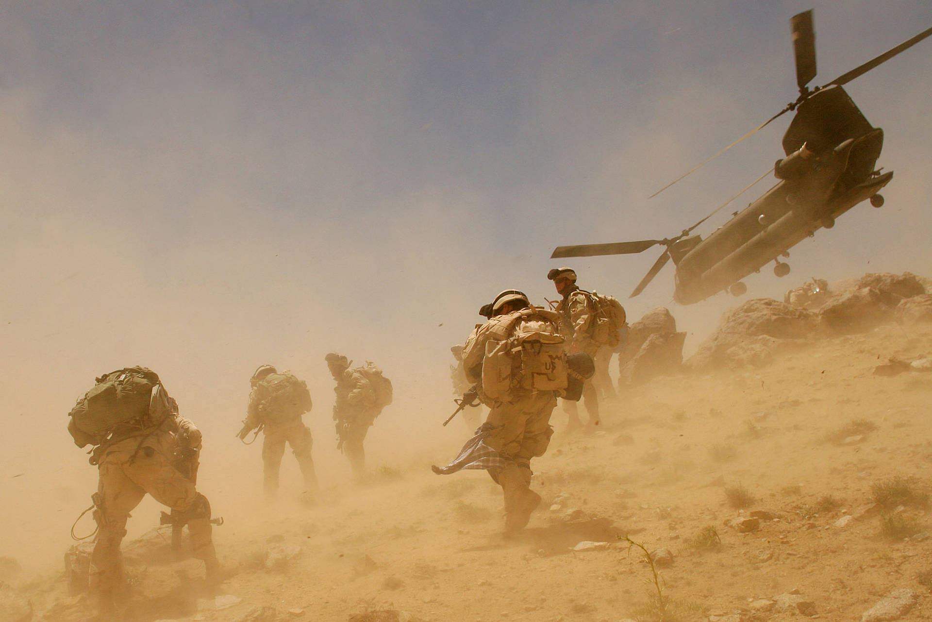 Caption: Afghanistan Military Forces in a Desert Storm Wallpaper