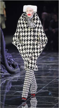 Striking Presentation of Alexander McQueen's Checkered Outfit from His Latest Collection Wallpaper