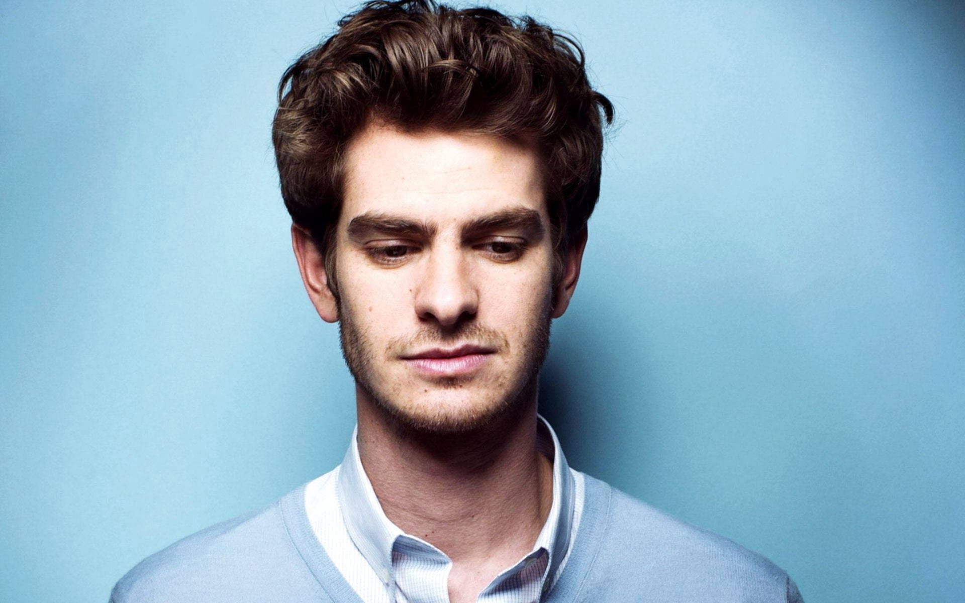 Andrew Garfield Engaged in a Sophisticated Photoshoot Wallpaper