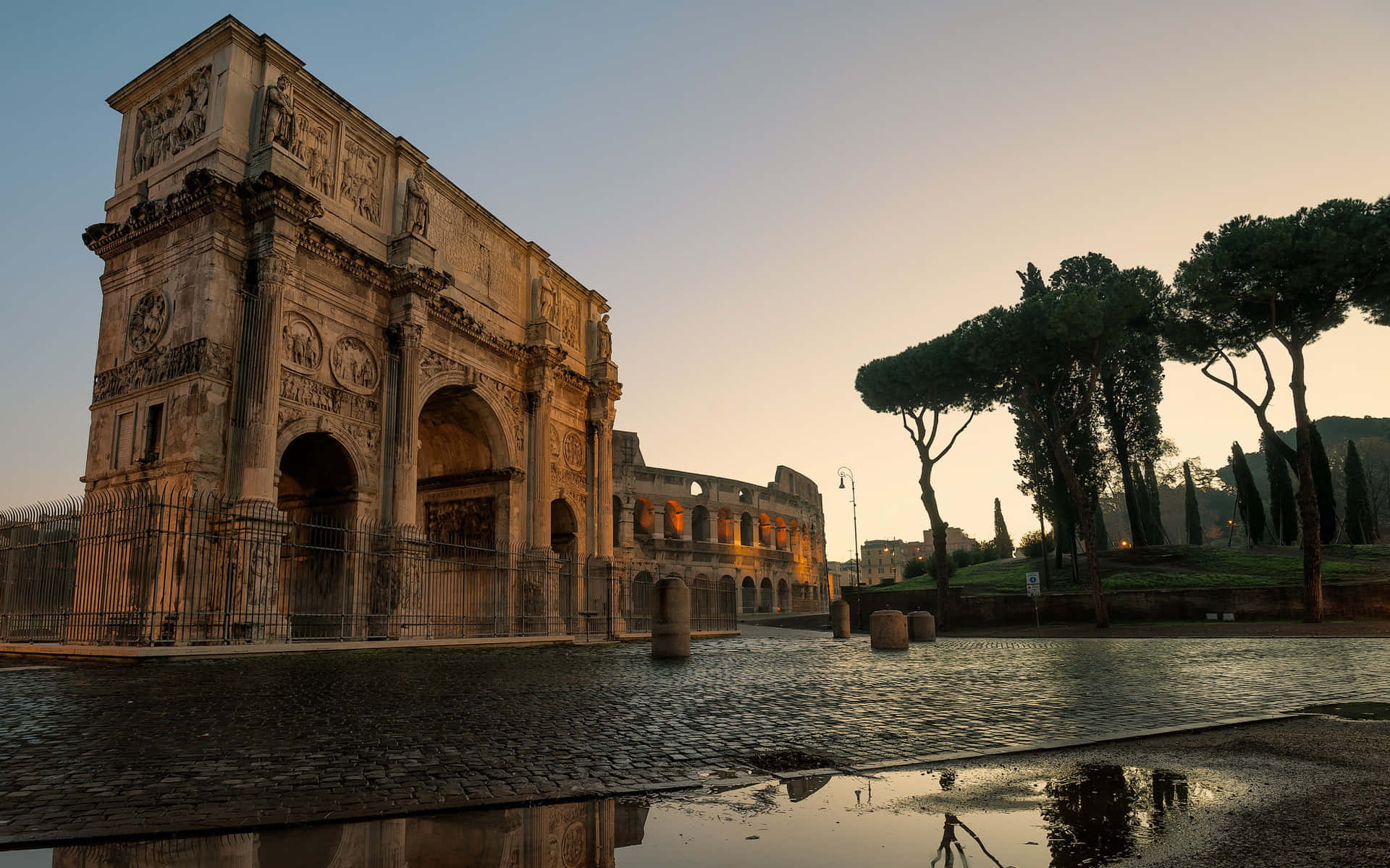 Majestic Arch of Constantine on a Rain-soaked Day Wallpaper
