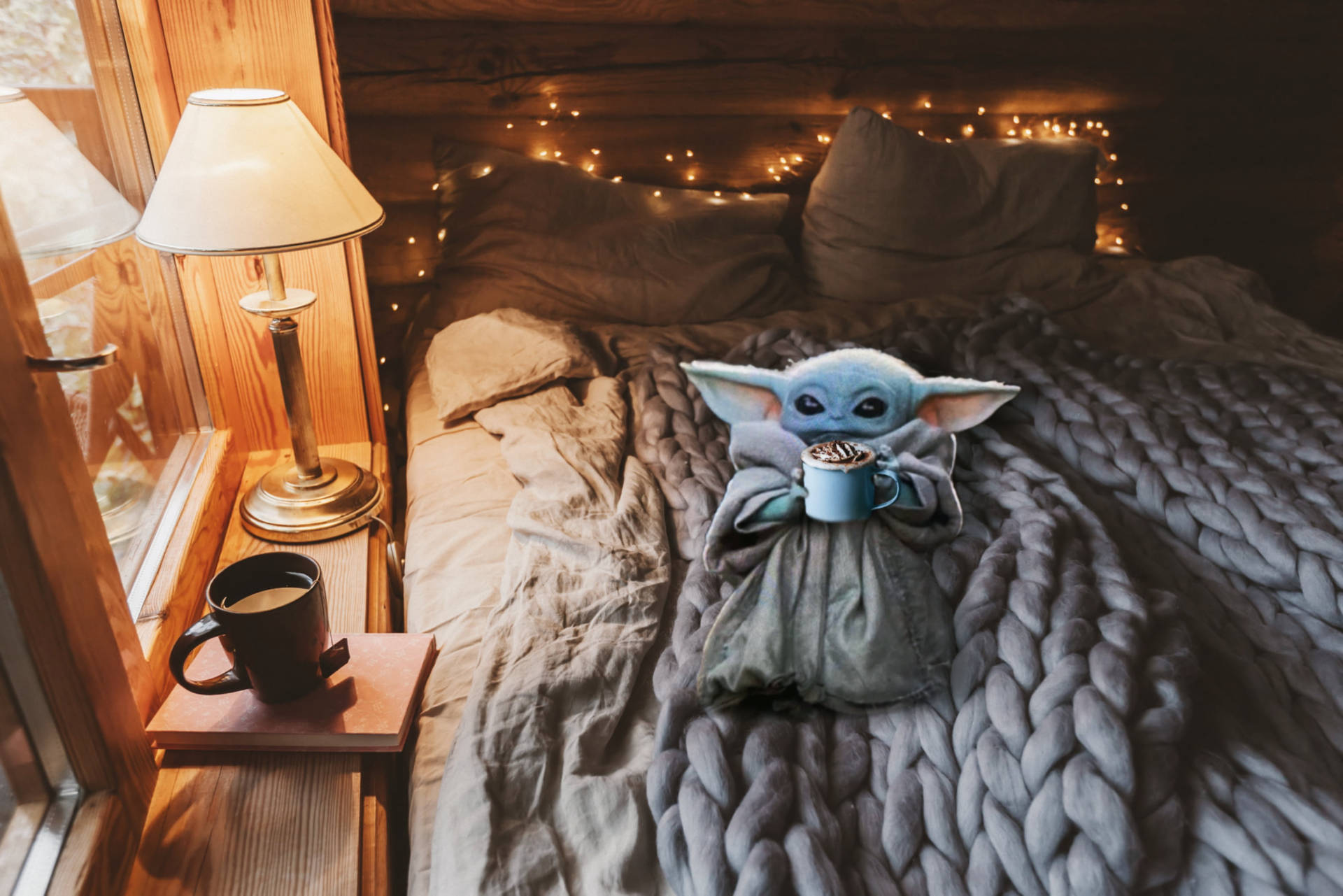 Baby Yoda On Cozy Winter Bed Wallpaper