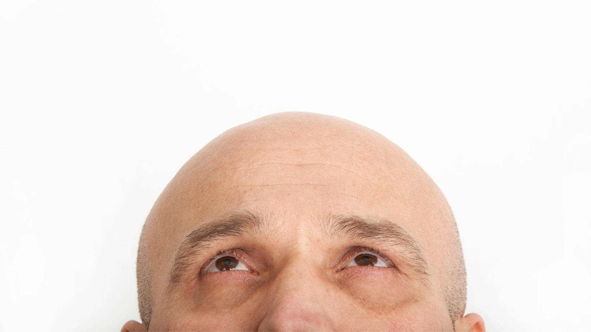 Bald Man Looking Up Wallpaper