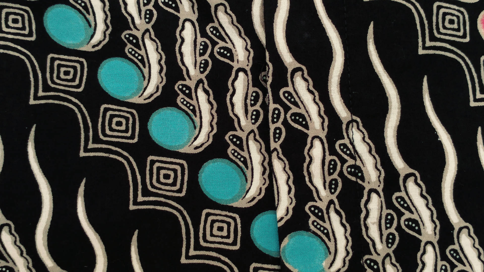 Exquisite Batik Creation with Turquoise Beads Wallpaper