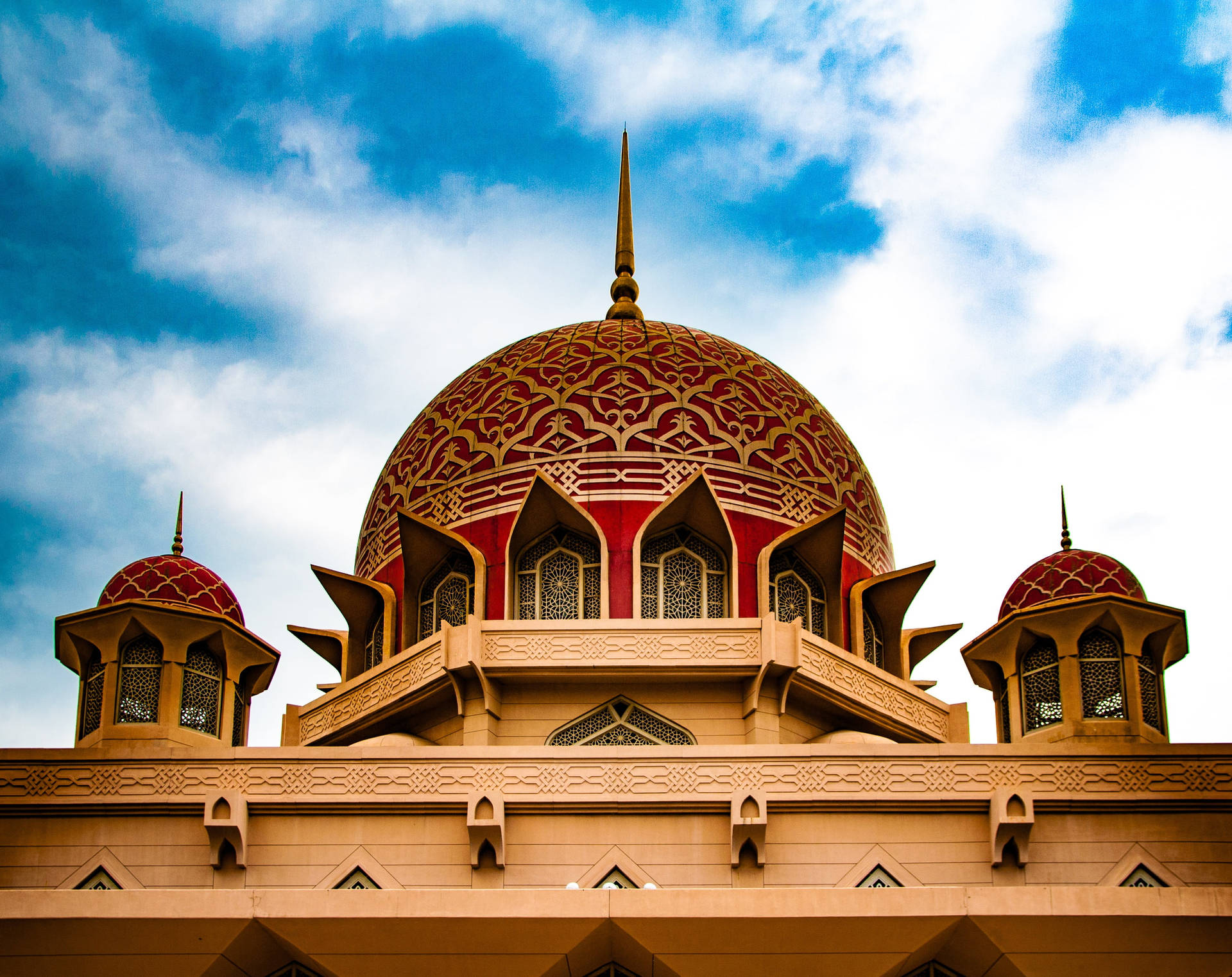 "Majestic Red Dome: A Display of Intricate Design in a Beautiful Mosque" Wallpaper