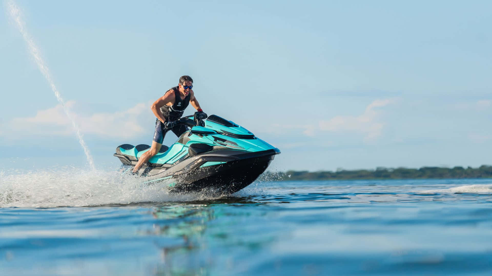 A Striking Blue and Black Jet Ski, Gliding Seamlessly Through The Water Wallpaper