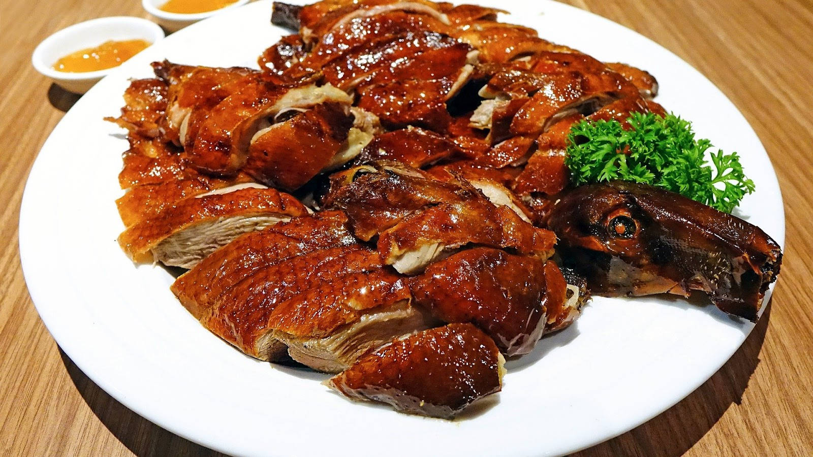 Sumptuous Roasted Peking Duck on a Plate Wallpaper