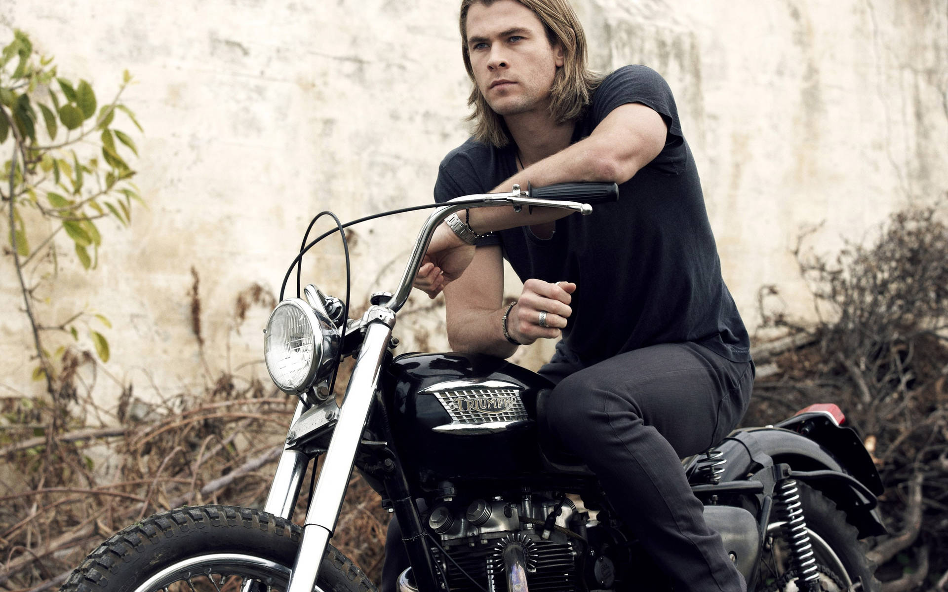 Chris Hemsworth Cruises On His Motorcycle Wallpaper