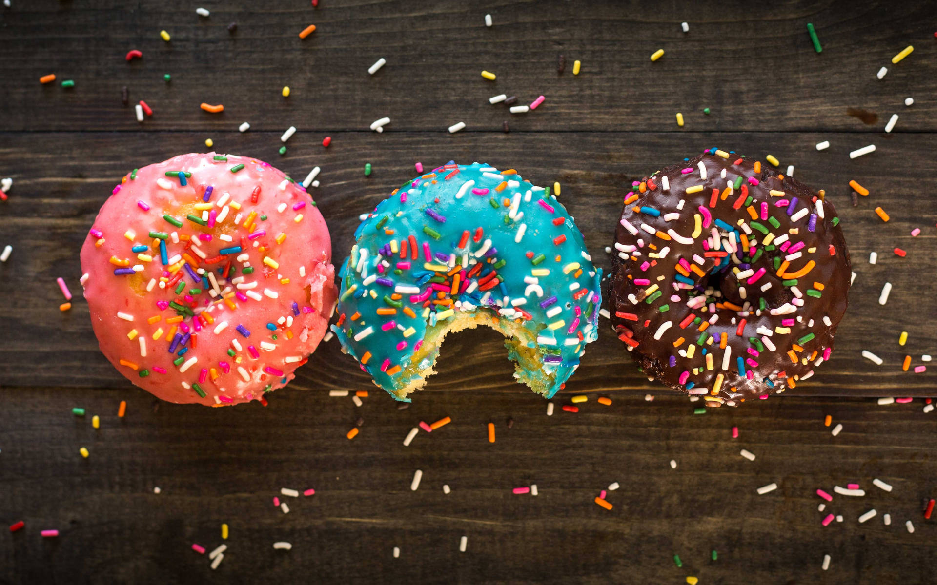 Colorful Sprinkled Donuts Wallpaper
