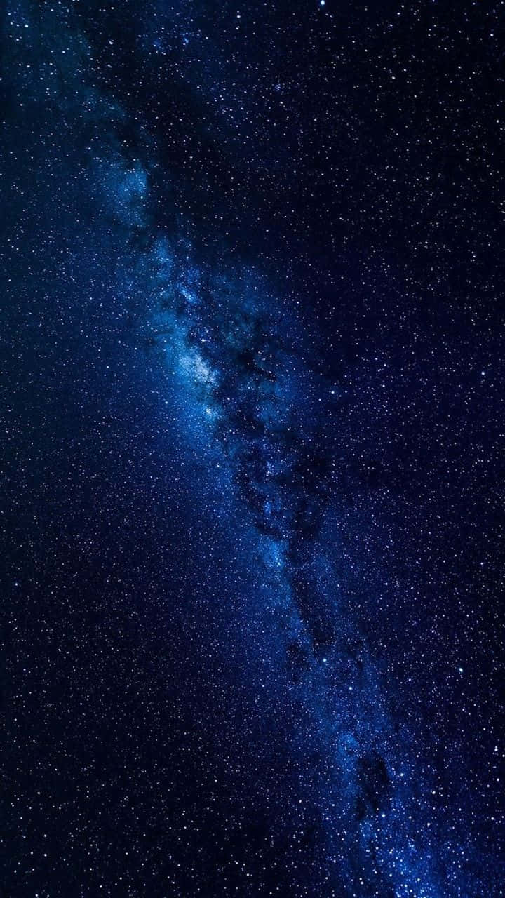 Look Up To The Starry Night Sky And Be Mesmerized By The Cool Blues Of The Galaxy Wallpaper