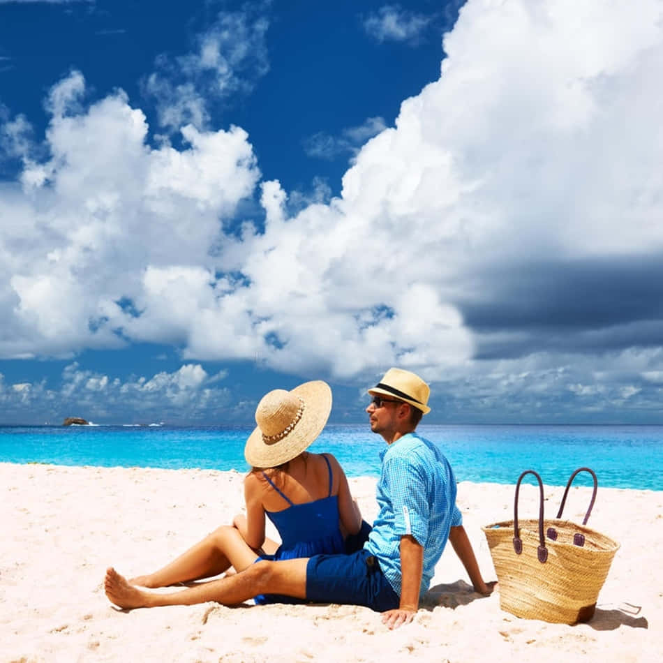 Couple At Beach Picnic On Sand Picture