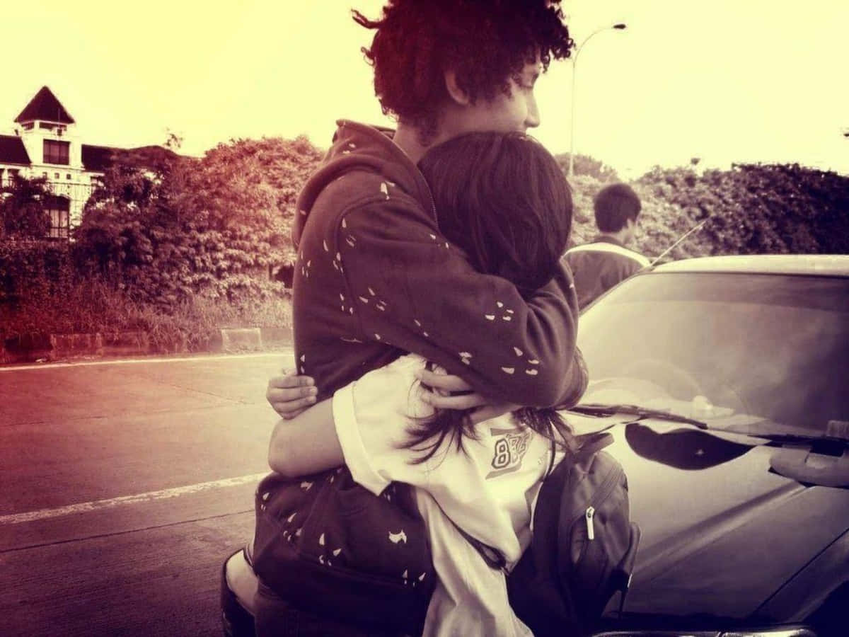 Couples Hugging With Car Picture