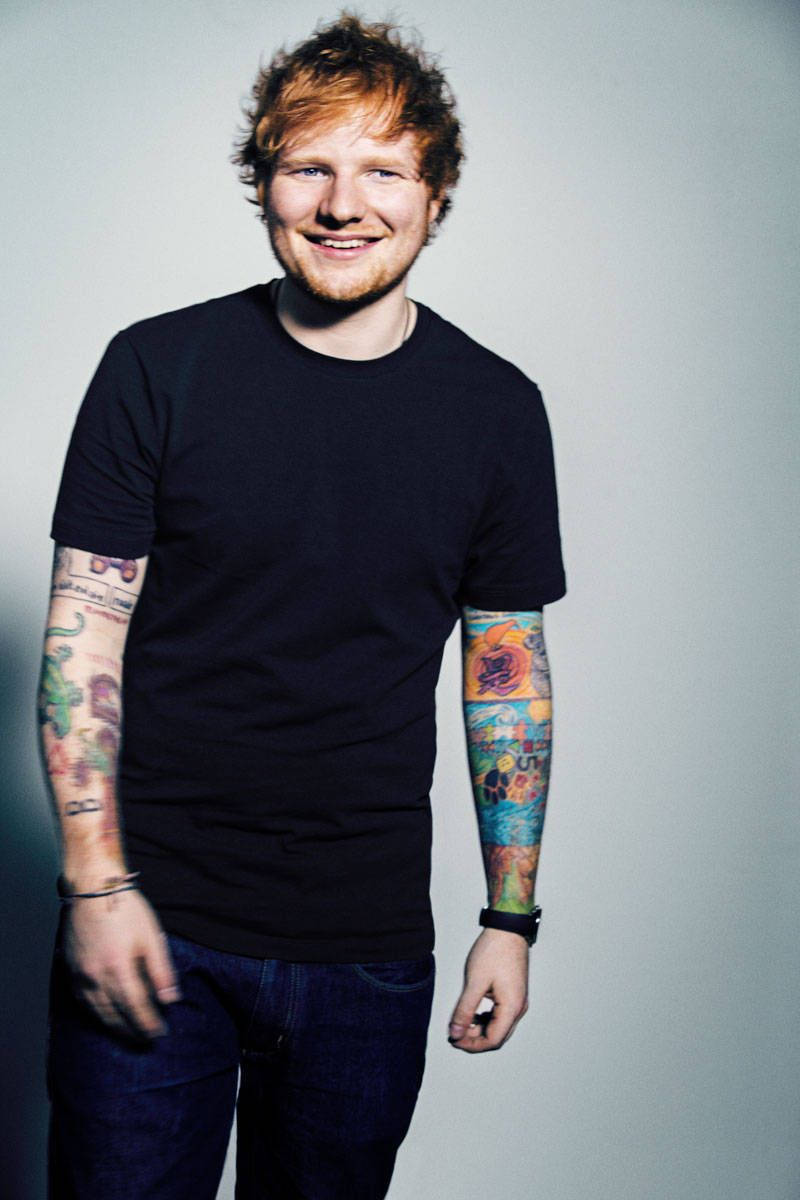 Ed Sheeran beaming with joy Wallpaper