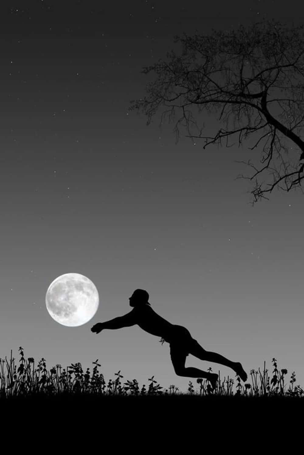 Cute Silhouette Man Playing Moon As Volleyball Wallpaper