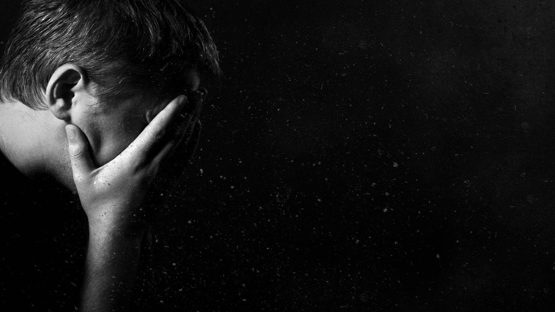 Emotional Distress - A Crying Man in Desolation Wallpaper