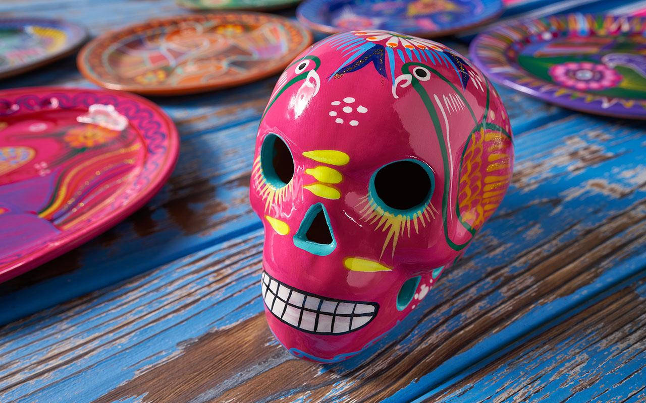 Vibrant Dia De Los Muertos Celebration Skull in Pink and Red Wallpaper