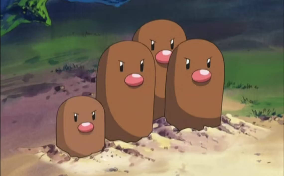 "Fierce and Fiery: A Close-up of Diglett and Dugtrio" Wallpaper