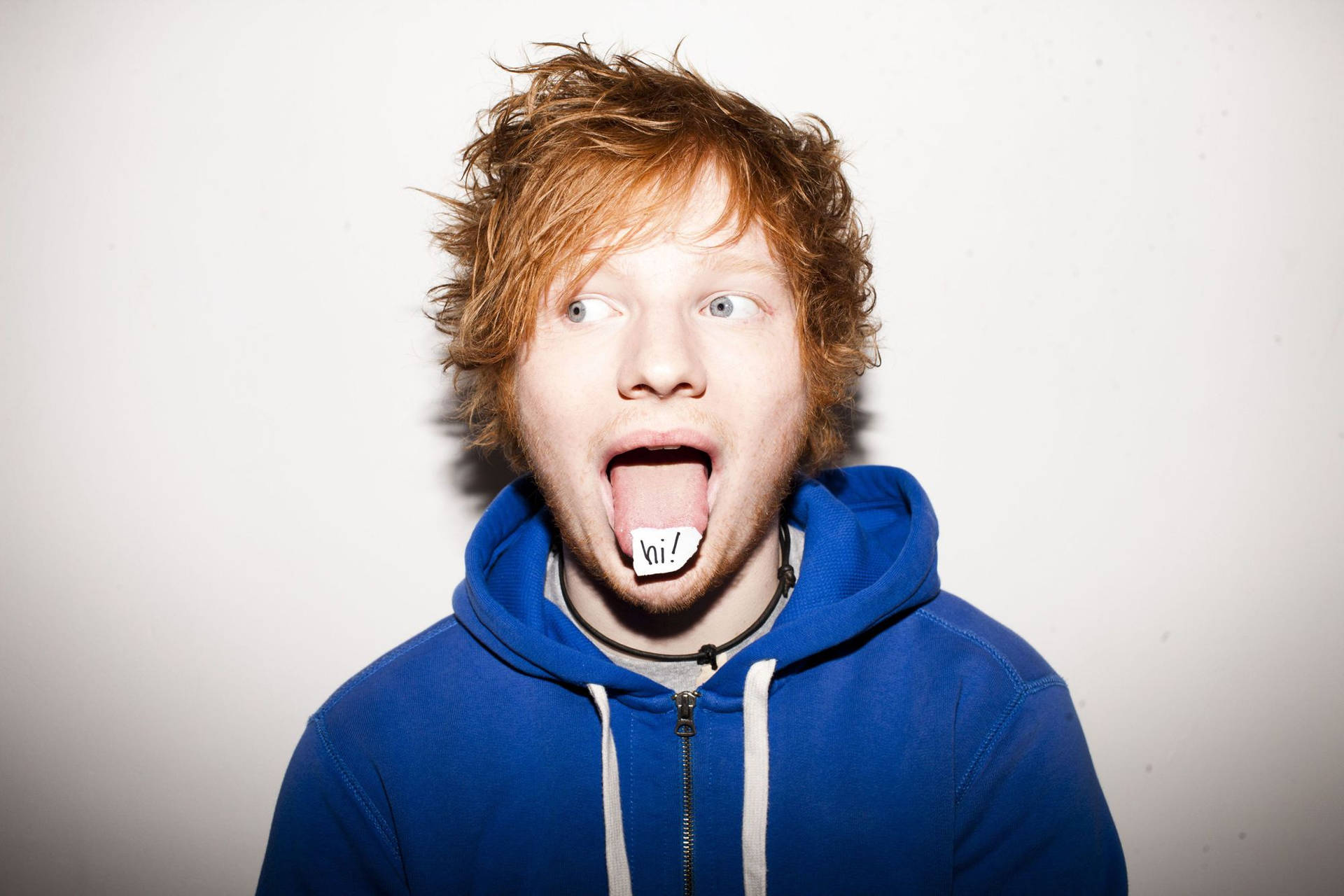 Ed Sheeran performs a comedic facial expression. Wallpaper