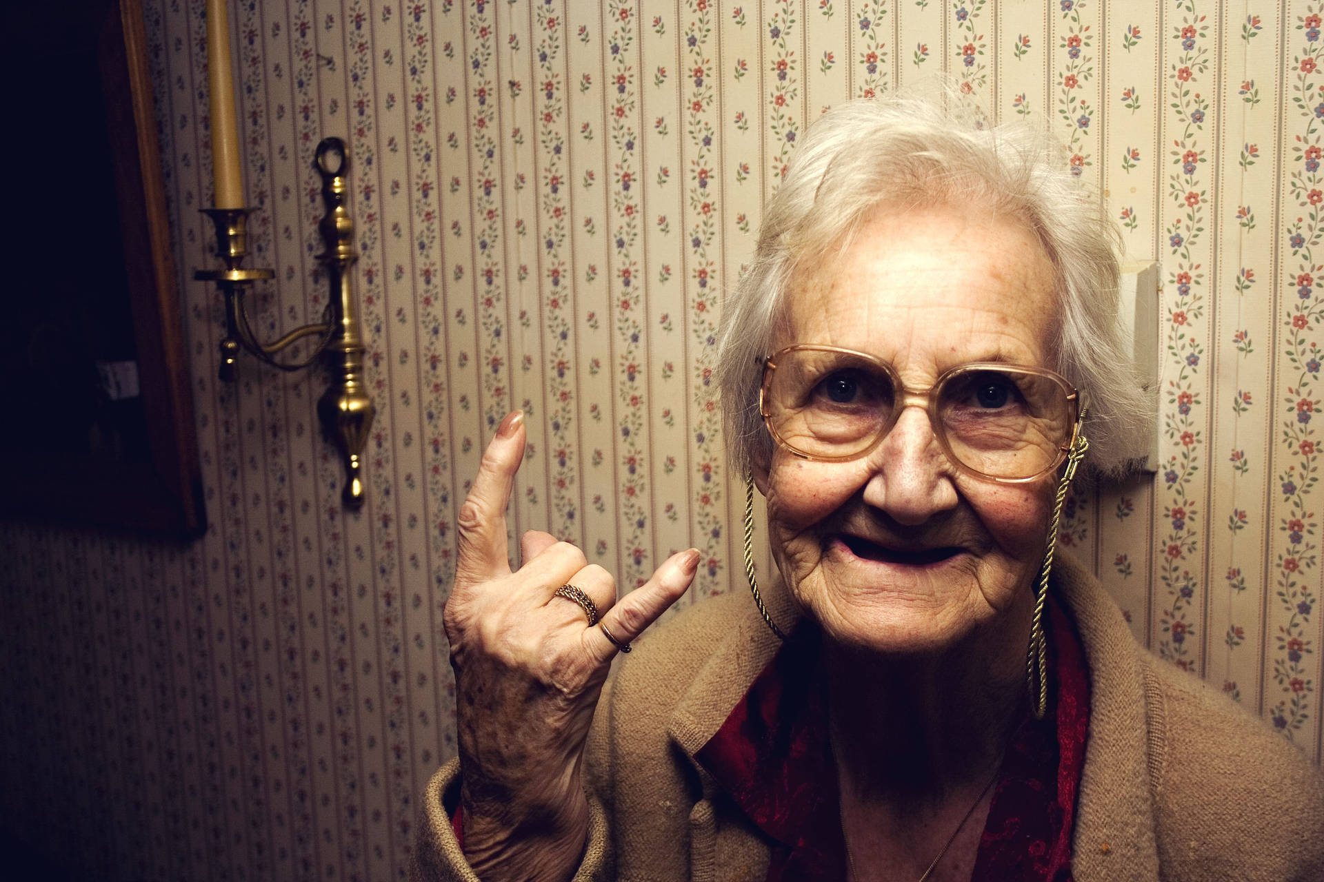 Elderly Woman Sign Of The Horn Wallpaper