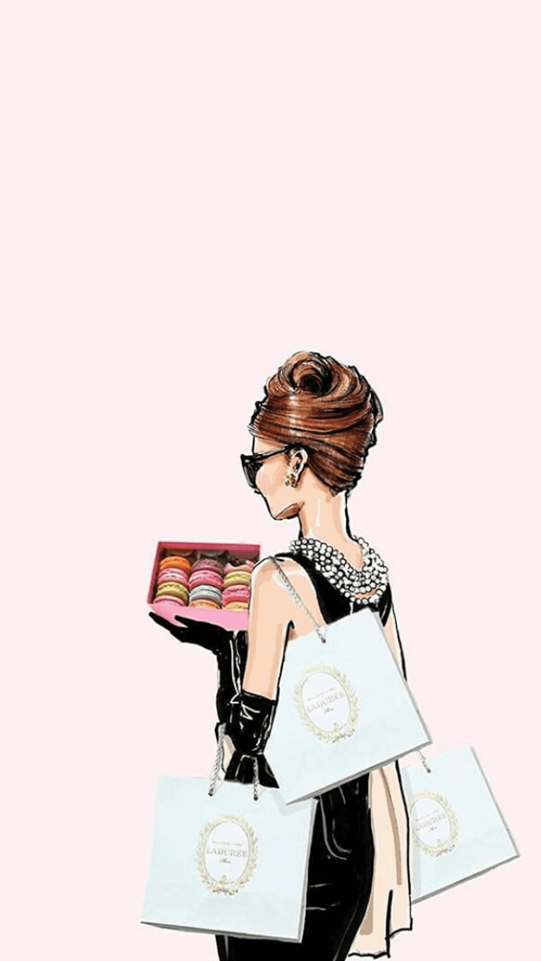 A Woman Is Holding A Bag Of Macarons