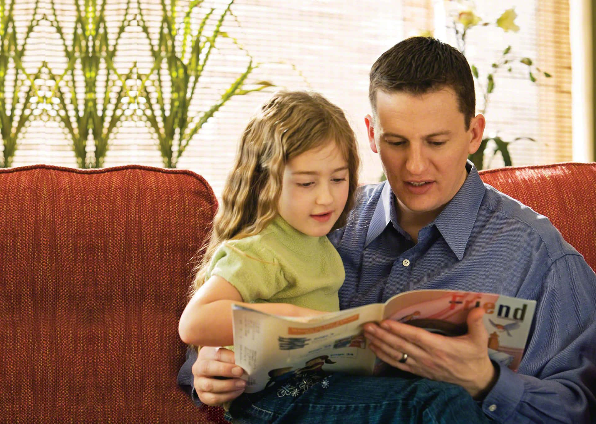 Father And Daughter Reading Magazine Picture