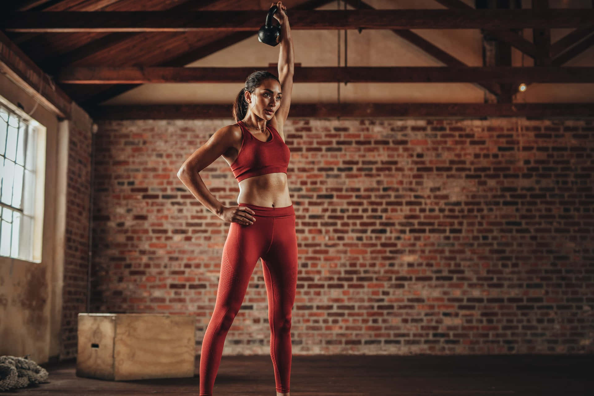 Female Body In Red Athletic Attire Wallpaper