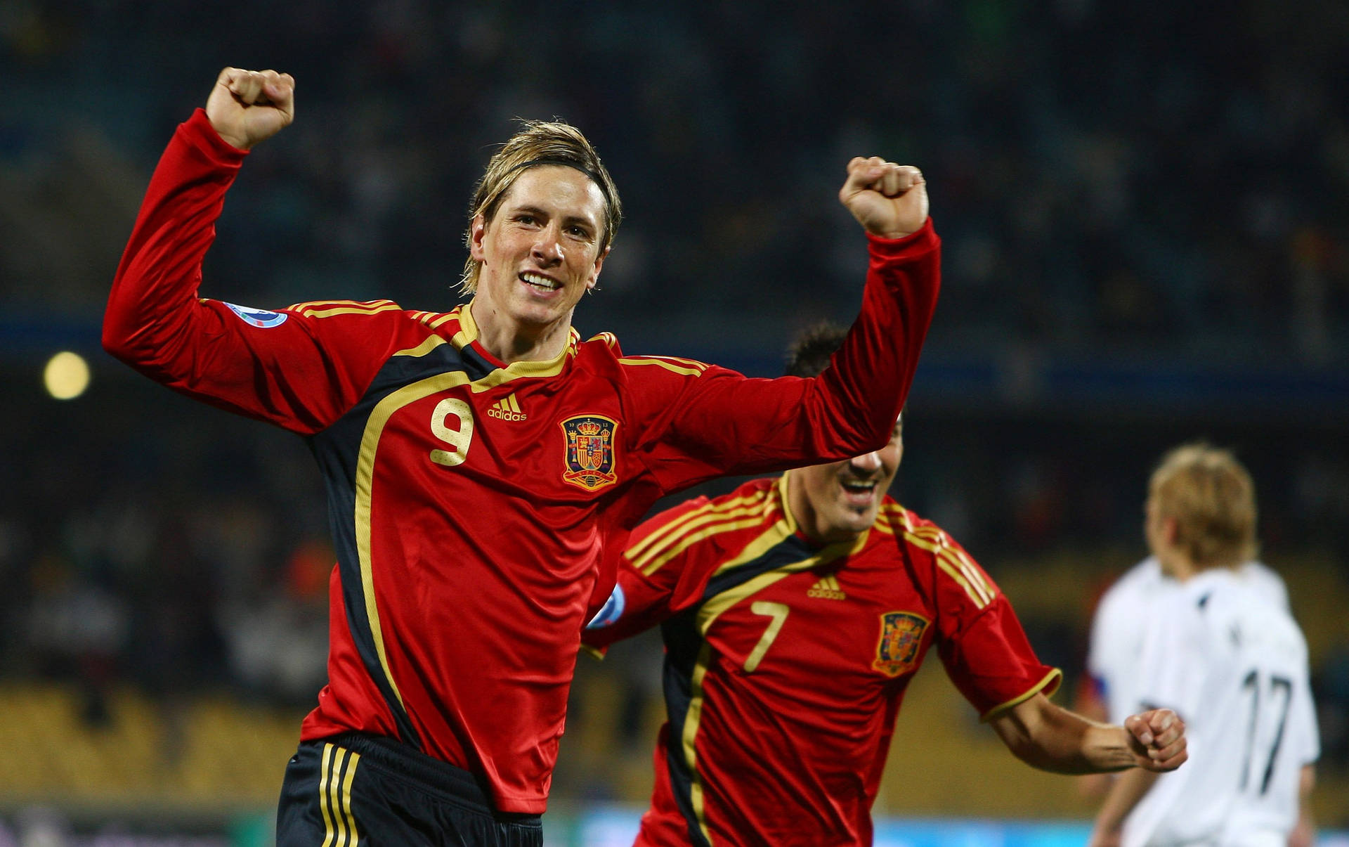 Fernando Torres and David Villa - Striking Legends of Spanish Football Wallpaper