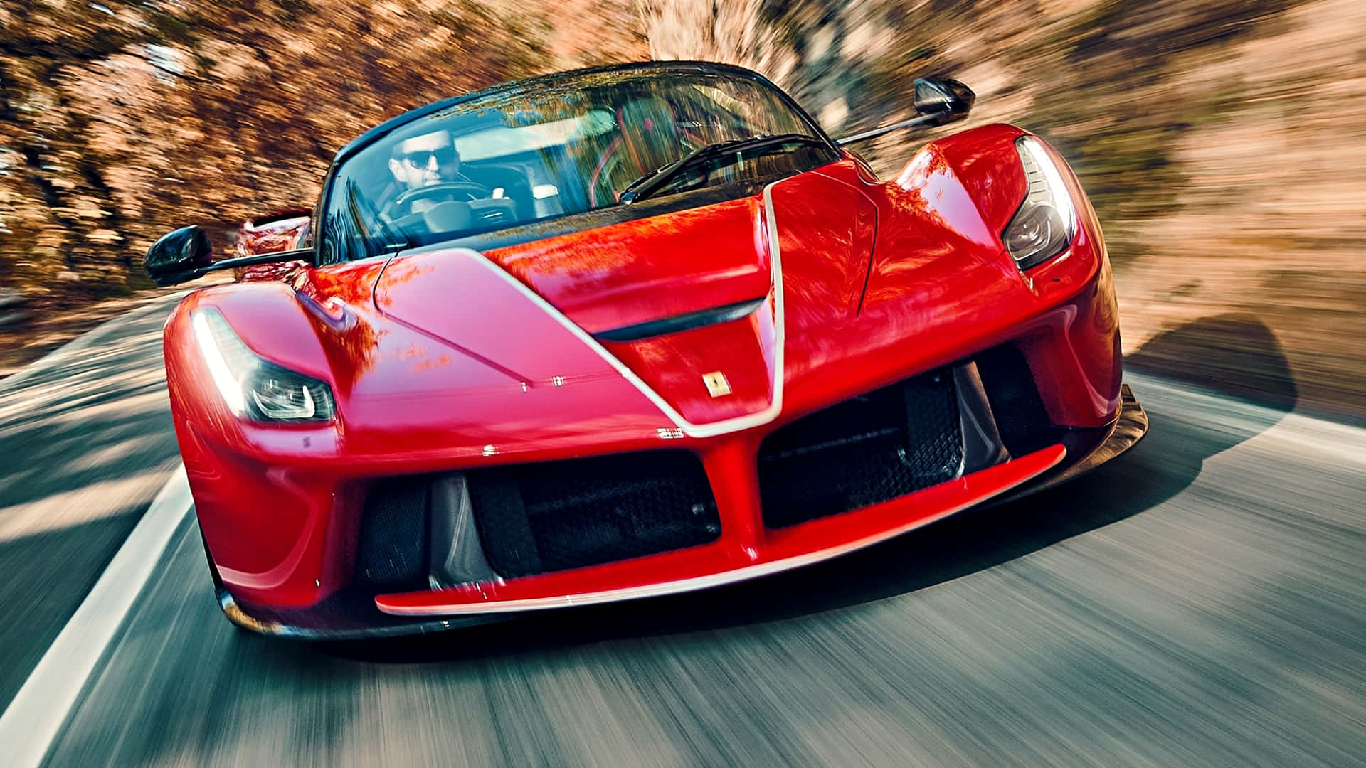 "Awe-inspiring Picture of a Red Ferrari Unleashing Power on the Road"