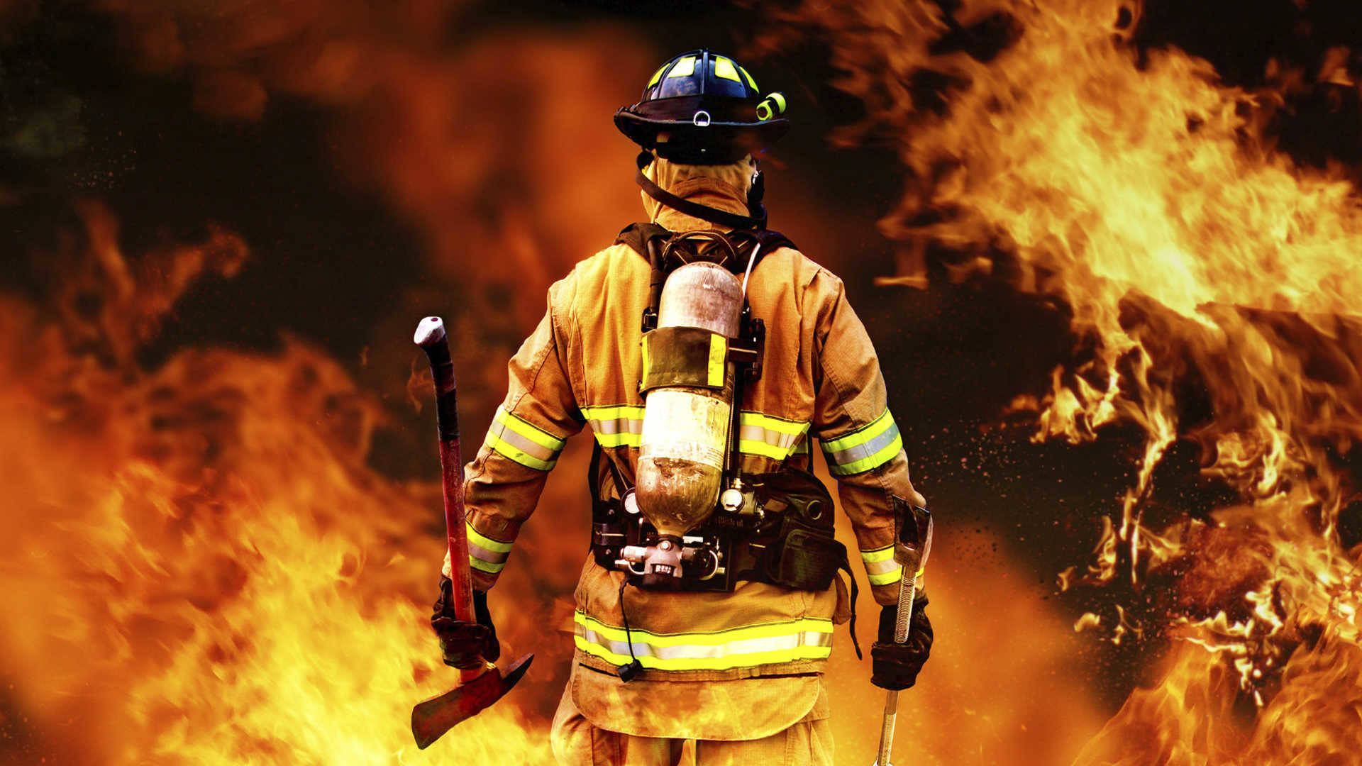 Fearless Firefighter Venturing Into the Blaze Wallpaper
