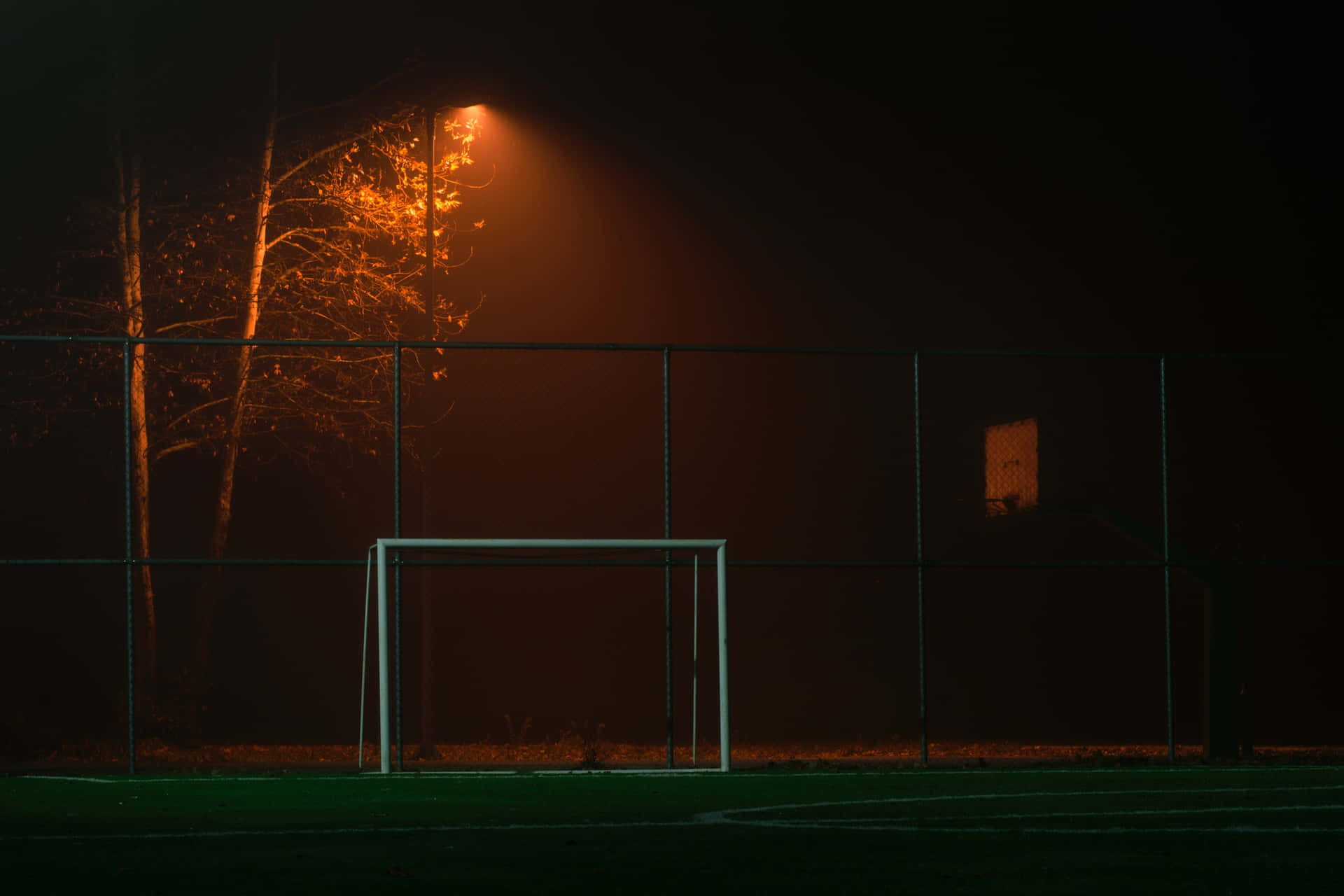 Football Field At Night Time Wallpaper