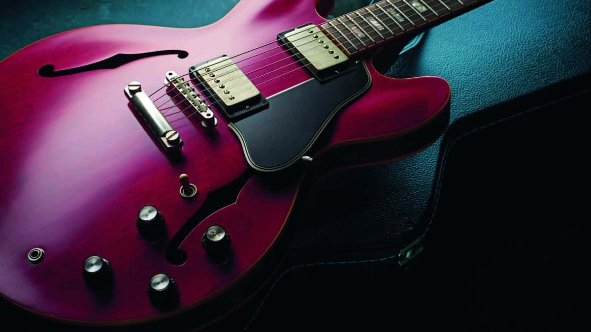 Take your creativity to the next level with the Gibson 335 electric guitar. Wallpaper