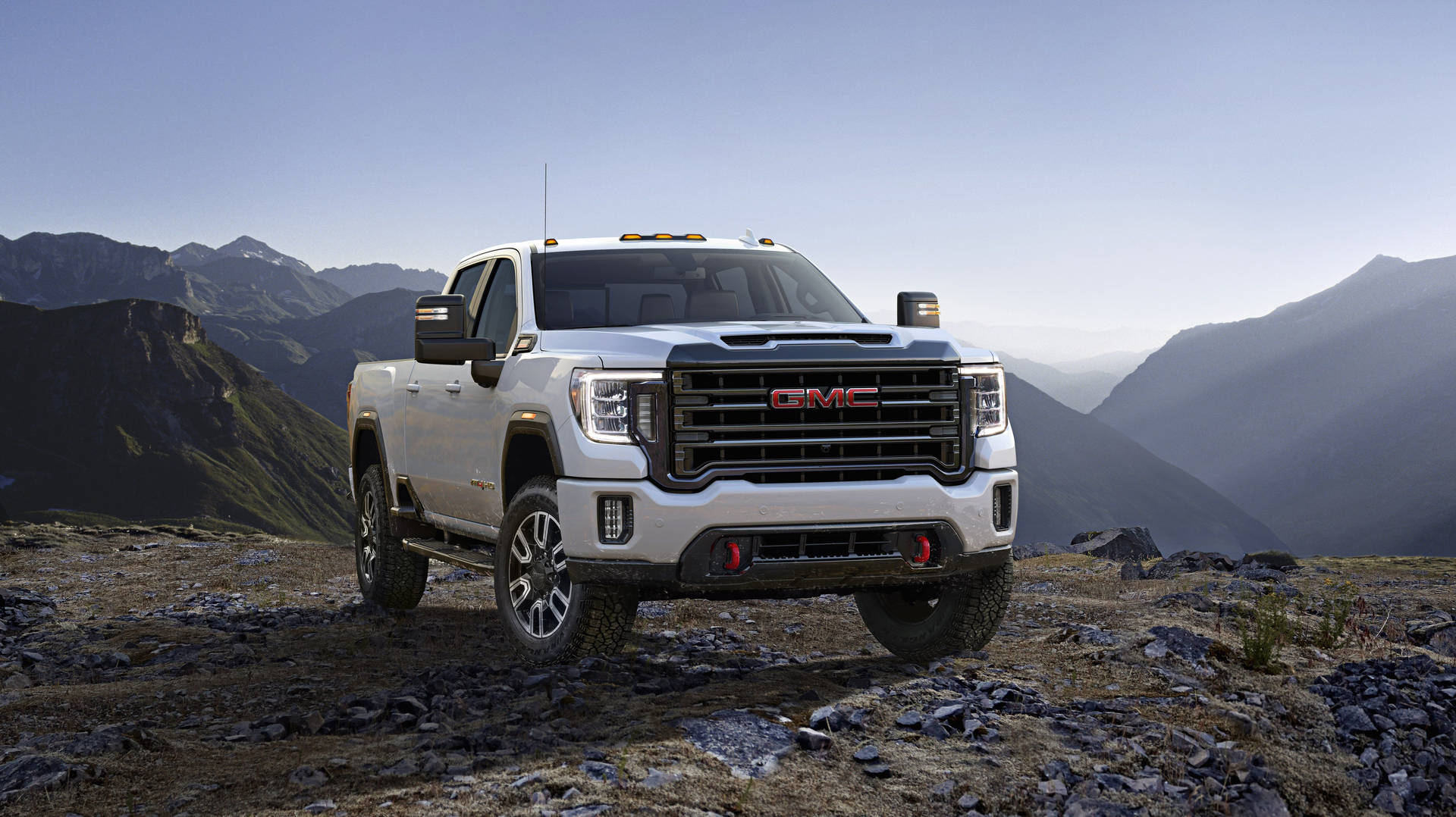 "Rugged GMC Truck Conquering Rocky Mountain Terrain" Wallpaper