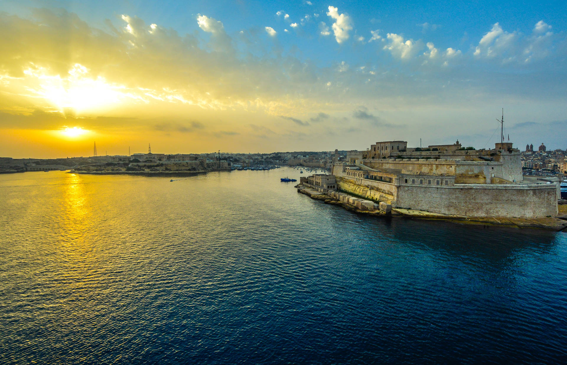 "Witness the majesty of a Grand Harbour Malta sunrise"- Wallpaper