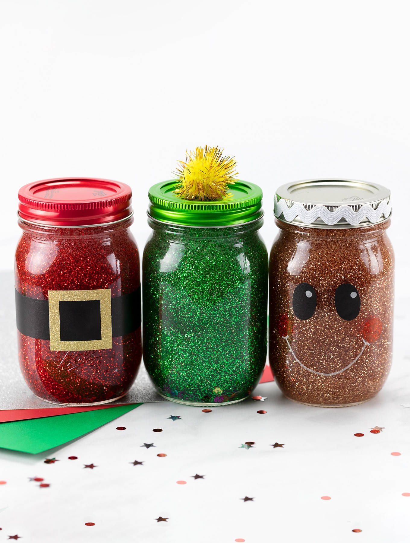 Three Mason Jars With Glitter And Santa Claus Wallpaper