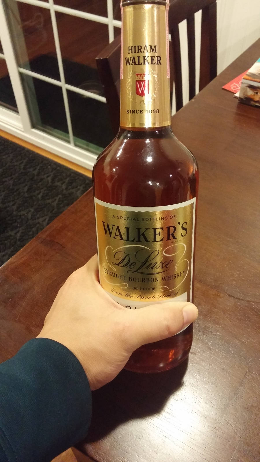 Exquisite bottle of Hiram Walker Deluxe Straight Bourbon Whiskey Wallpaper