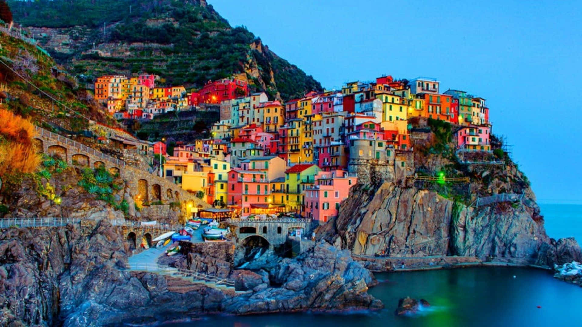 A Colorful Village On A Cliff Overlooking The Ocean