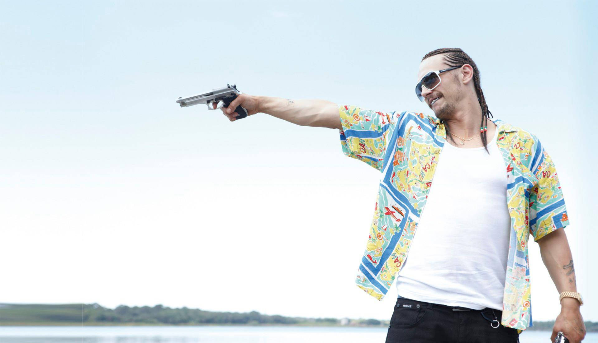 Caption: James Franco posing in character from his movie Spring Breakers Wallpaper