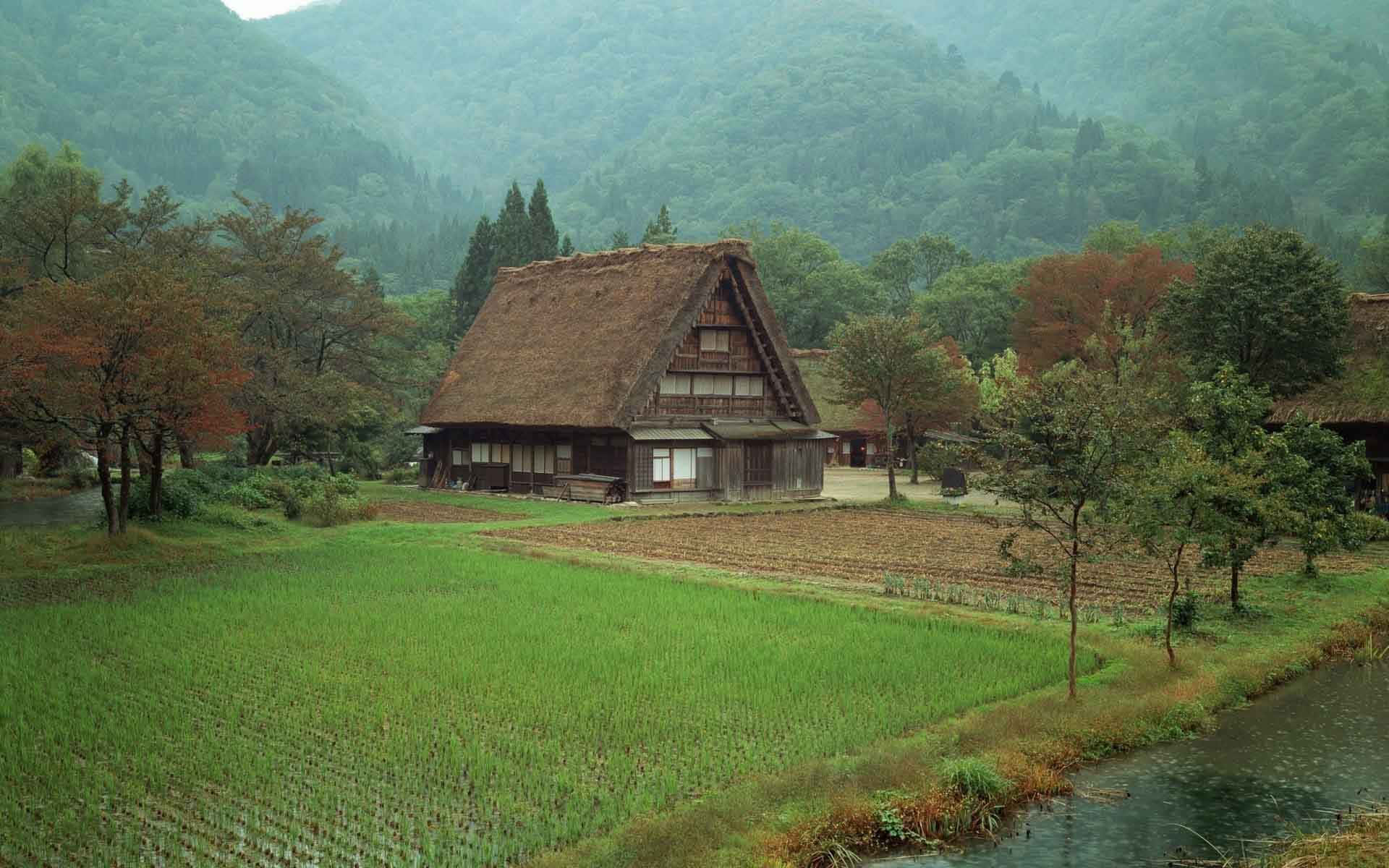 Tranquil Japanese Farmhouse Resting in the Countryside Wallpaper