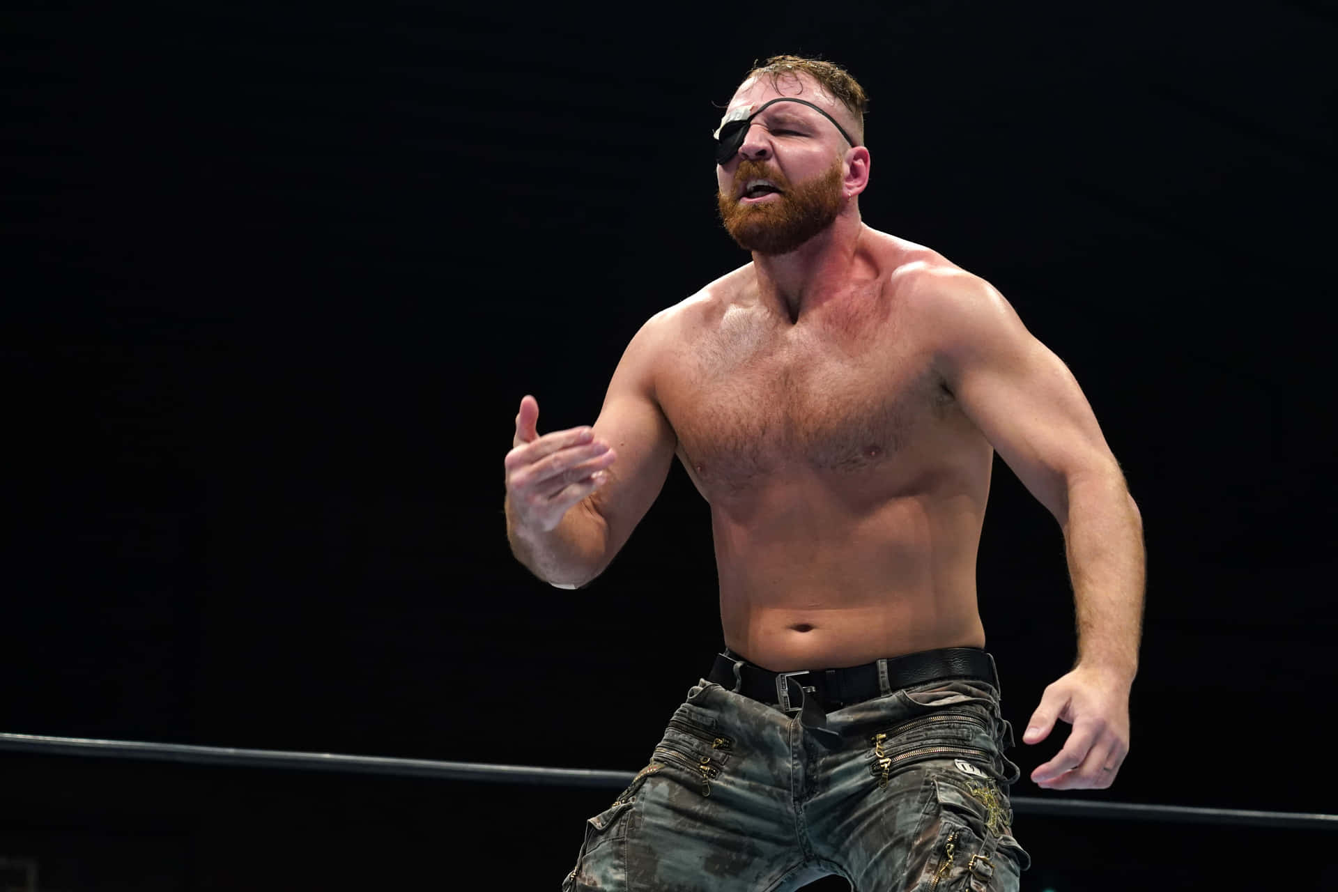 Jon Moxley pops with striking eyepatch - Portrait Action Shot Wallpaper