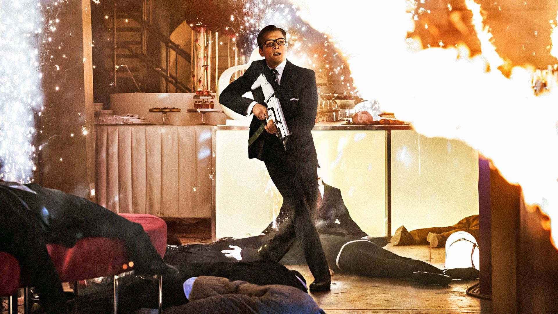 Action-packed scene from Kingsman: The Secret Service featuring Eggsy Wallpaper