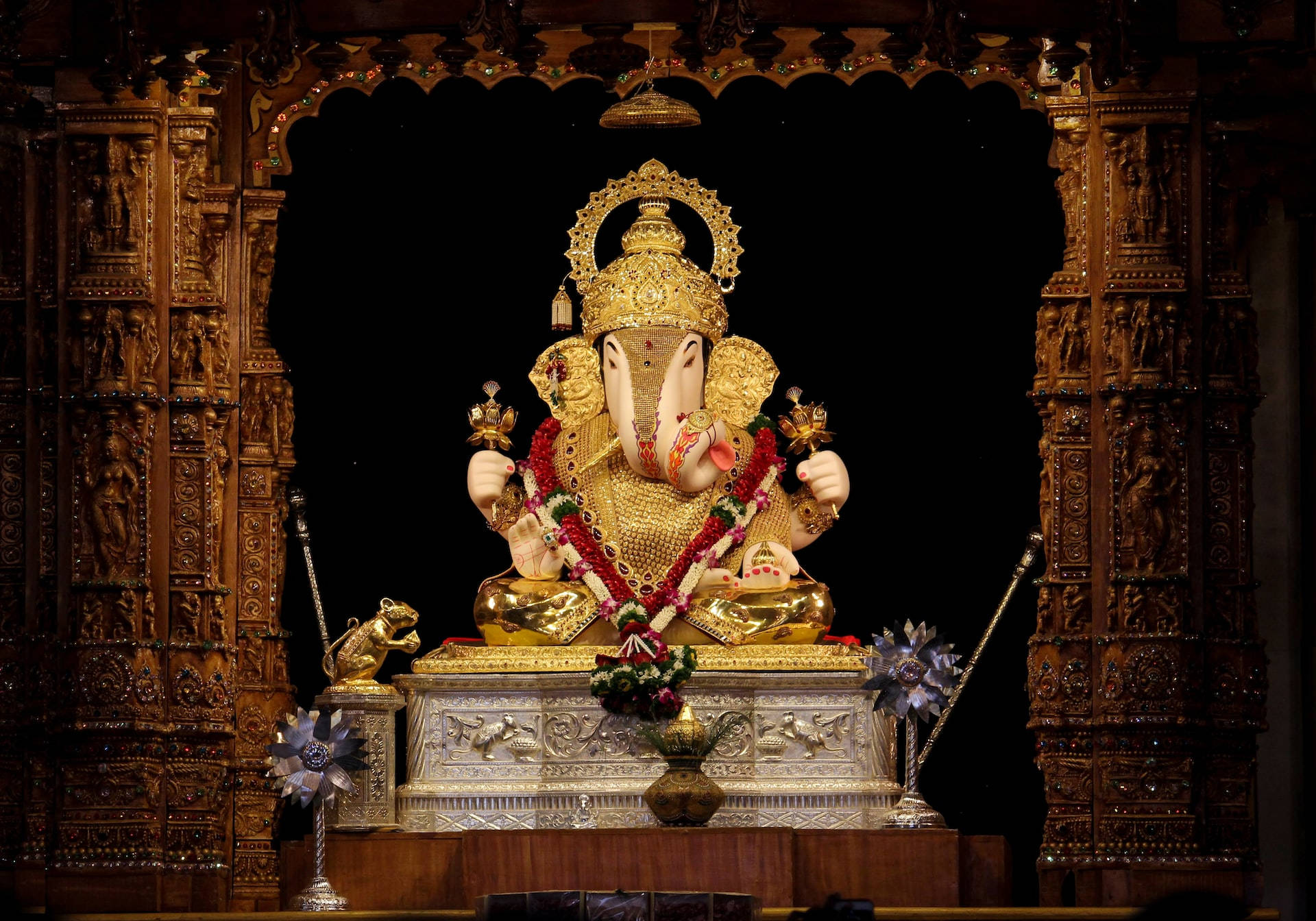 Divine Golden Ganesha Statue On Desktop Wallpaper
