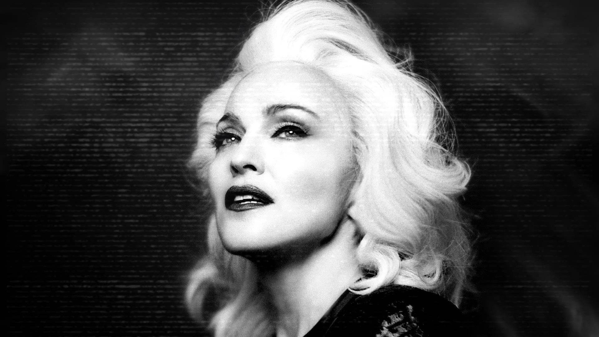 Madonna looking strong and confident. Wallpaper