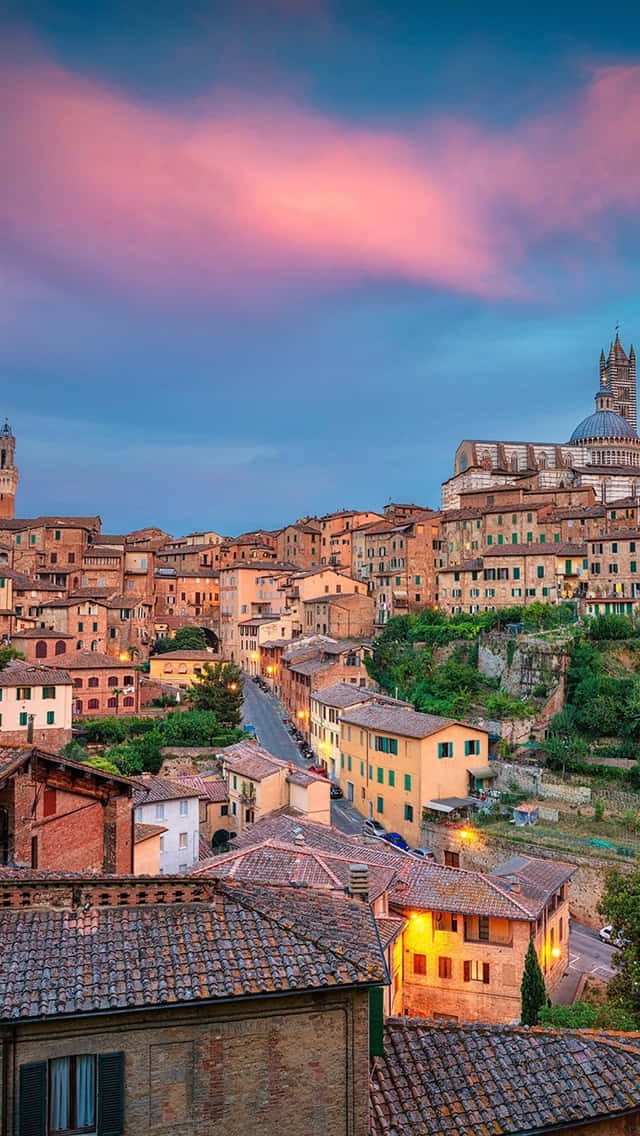 Medieval Houses dotting the landscape in Siena Wallpaper