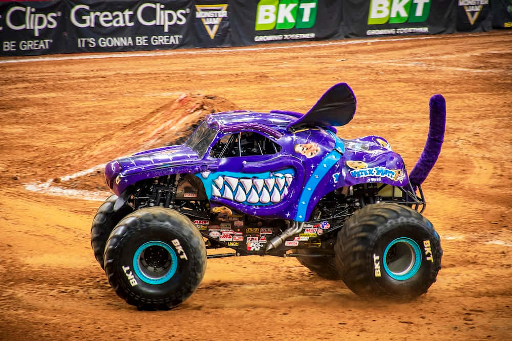 Exhilarating Monster Truck Performance in an Arena