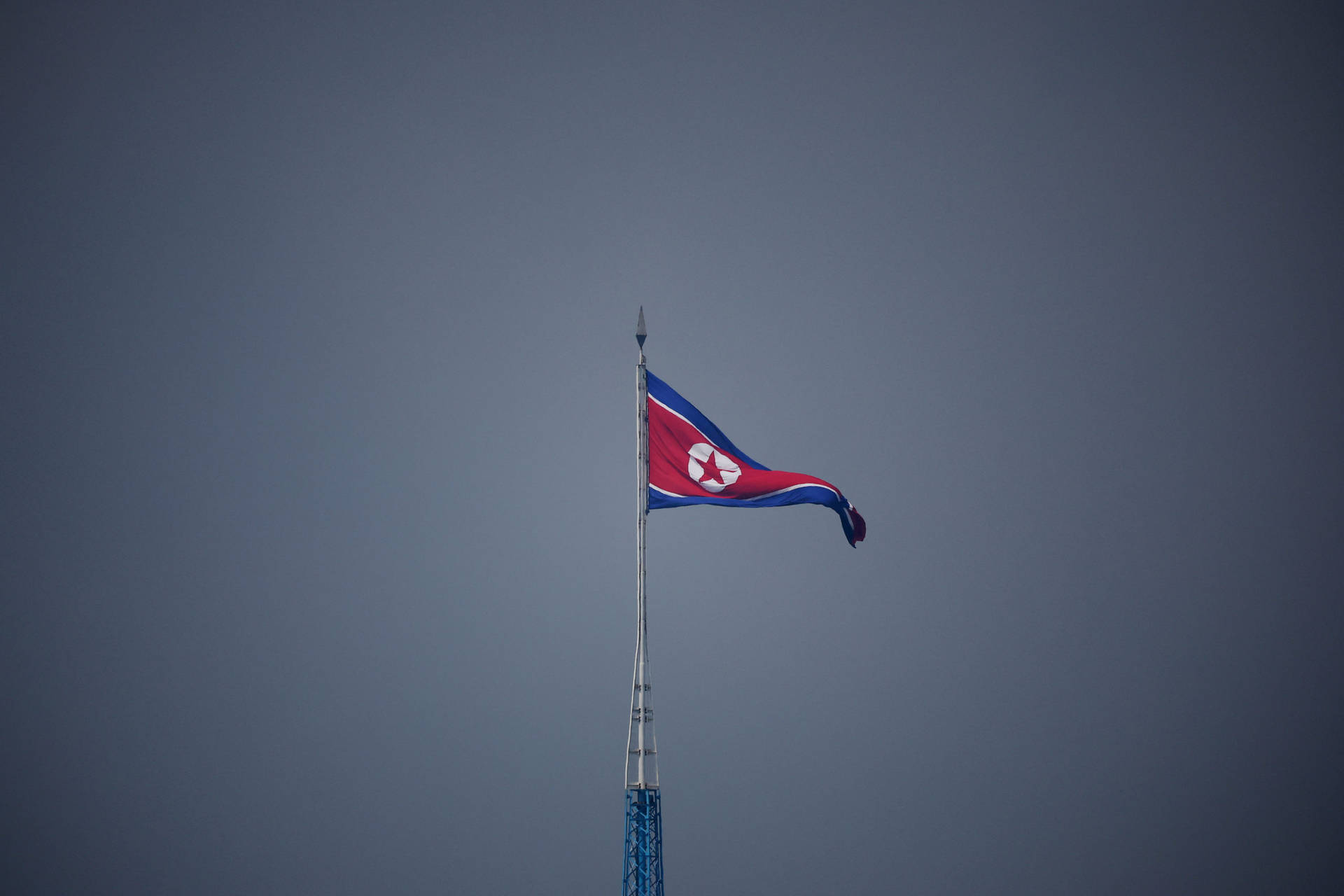 North Korea Flag On High Pole Wallpaper
