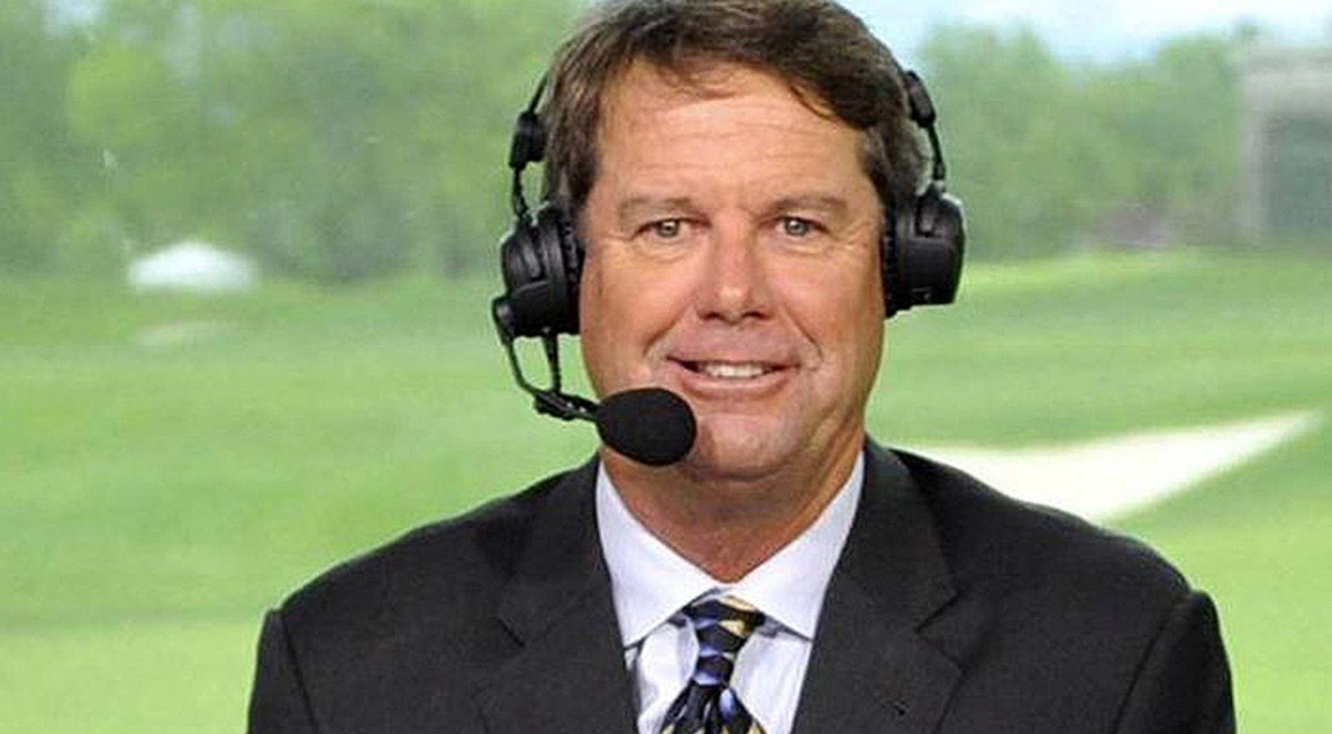 Caption: Renowned Golfer, Paul Azinger in Broadcasting Headset during a Golf Tournament Wallpaper
