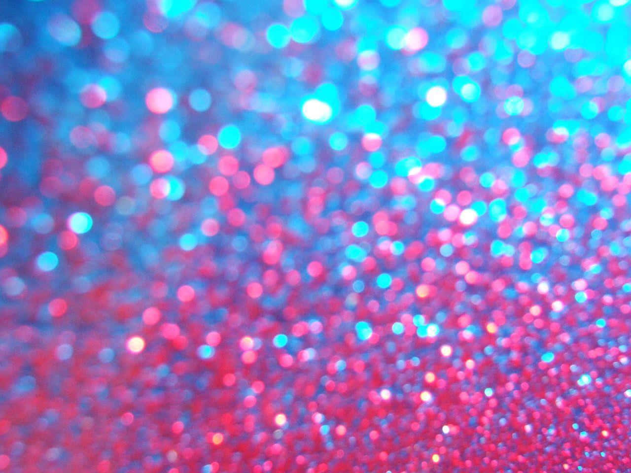 A Close Up Of A Blue And Pink Glitter Background