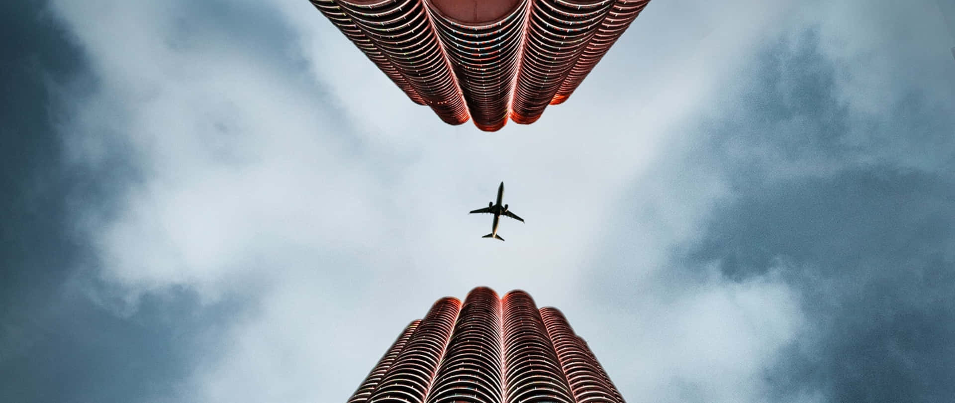Plane Desktop Between Buildings Wallpaper