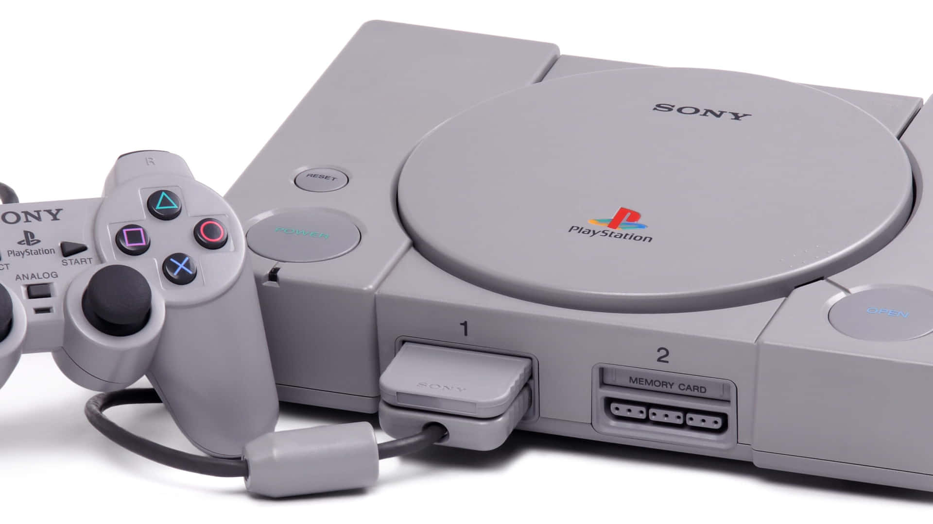 A Sony Classic Console With Two Controllers